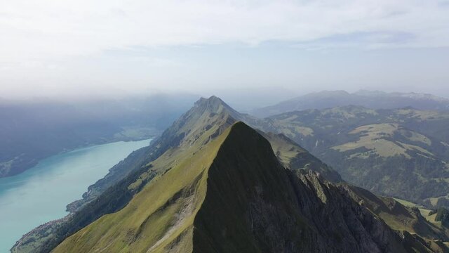Amazing footage over the beautiful places in Switzerland. A wonderful areal flight at a sunny day in the alps. Epic drone flight over the beautiful mountains at the lake Brienz called Brienzergrat.