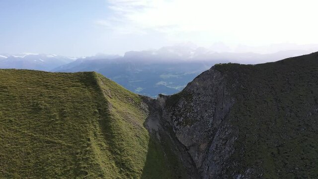 Amazing footage over the beautiful places in Switzerland. A wonderful areal flight at a sunny day in the alps. Epic drone flight over the beautiful mountains at the lake Brienz called Brienzergrat.