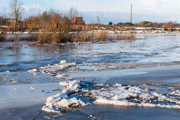 Close up view of ice drift on the frozen river. Melting ice. Stack of ice. Concept of spring floods
