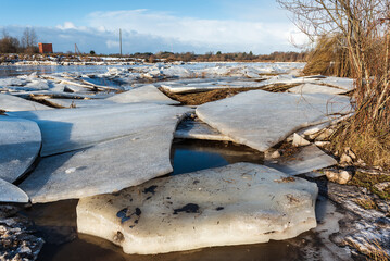 Close up view of ice drift on the frozen river. Melting ice. Stack of ice. Concept of spring floods