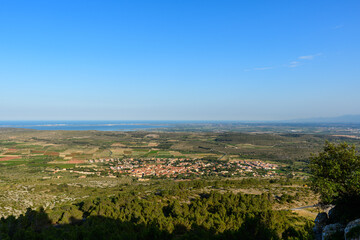 The village seen from Chateau de Opoul Perillos in Europe, France, Occitanie, Pyrenees Orientales, in summer, on a sunny day.