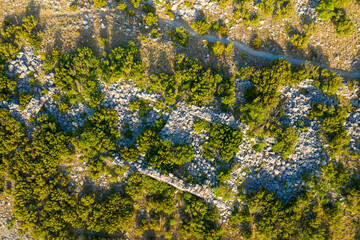 The remains of a stone house towards the Chateau de Opoul Perillos in Europe, France, Occitanie, Pyrenees Orientales in summer on a sunny day.