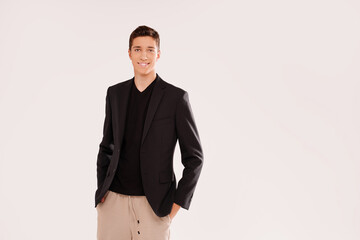 Portrait of smiling, handsome teenage boy in elegant clothes . Studio shot. Teen fashion. Real people emotions.