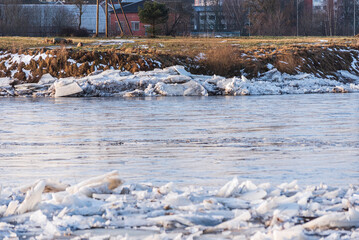 Close up view of ice drift on the frozen river. Melting ice. Stack of ice. Concept of spring floods