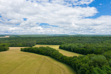 The French Countryside with forests and wheat fields after harvest in Europe, France, Burgundy, Nievre, in summer on a sunny day.