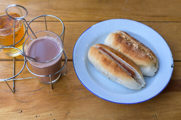 Vietnamese bread on plate and glass of hot drink for breakfast.