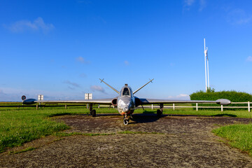 An airplane in front of the airfield of the traditional French village of Saint Sylvain in Europe, France, Normandy, towards Veules les Roses, in summer, on a sunny day.