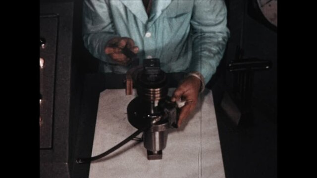 Solenoid Demonstration 1967 - A technician demonstrates the funtion of an industrial solenoid in 1967.