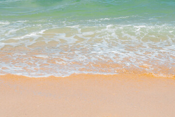 Close up, beach with small waves and clean sand