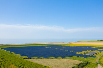 Norman Solar Panels at the edge of the cliffs and the Channel Sea in Europe, France, Normandy, in summer on a sunny day.