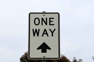 one way sign against sky