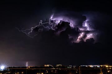 Lightning through a thick storm cloud