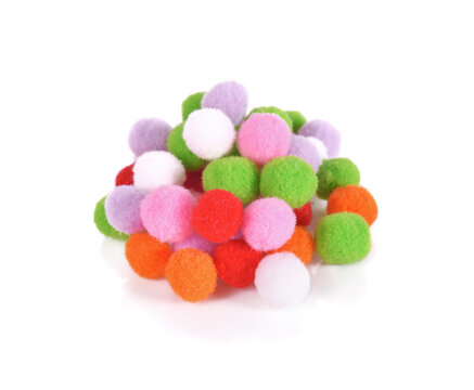 Colorful Pom Poms on a white background