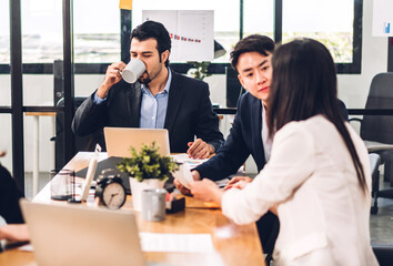 Group of asian professional business meeting and discussing with new startup idea project.Creative business people planning strategy analysis and brainstorm with document report in office.Teamwork