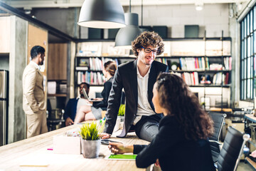 Group of professional business meeting and discussing strategy with new startup project.Creative business people planning and brainstorm with laptop computer in modern workloft.Teamwork concept