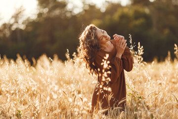Stylish woman spending time in a summer field
