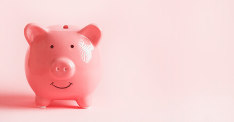 Cute pink piggy bank, close up view.