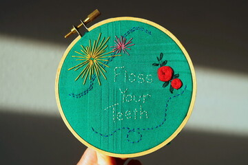 Funny embroidery. Floss your teeth sign.