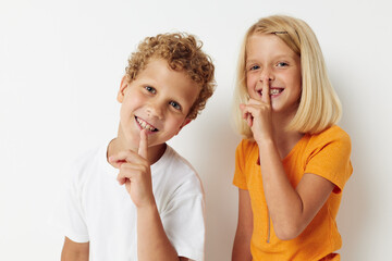 Boy and girl hand gestures fun childhood isolated background unaltered