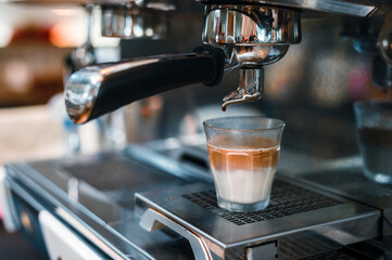 Dirty Coffee - A glass of espresso shot mixed with cold fresh milk in coffee shop cafe and restaurant