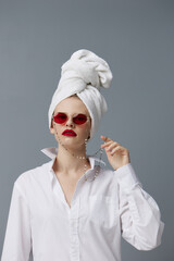 woman with a towel on his head in a white shirt studio model unaltered
