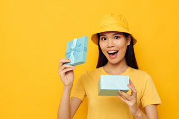 woman with a gift box in his hands surprise emotions studio model unaltered 