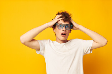 portrait of a young curly man Youth style glasses posing isolated background unaltered