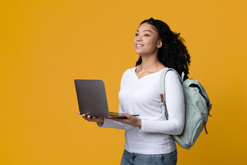 Online Education Concept. Portrait Of Black Female Student With Backpack And Laptop