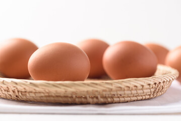 Fresh organic chicken eggs on white background.