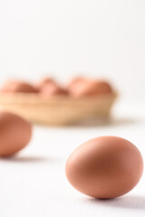 Fresh organic chicken eggs on white background.
