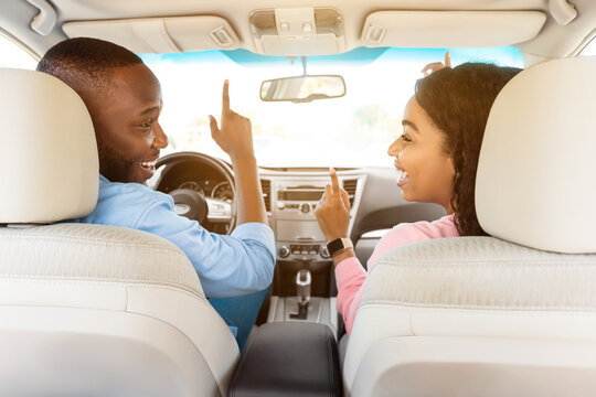 Happy Black Couple Enjoying Music Driving Nice Car