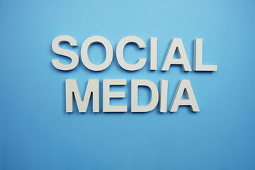 Social Media alphabet letters on blue background