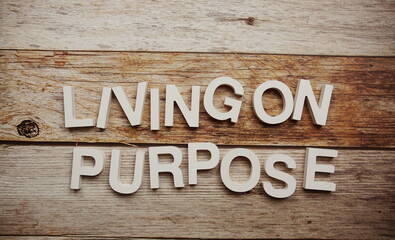 Living on Purpose alphabet letters on wooden background