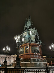 Monument to Nicholas 1 the All-Russian Emperor, surrounded by an old fence and beautiful lanterns.