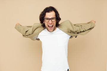 Attractive man spectacled beige suit elegant style beige background