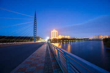 Bridge and city at night