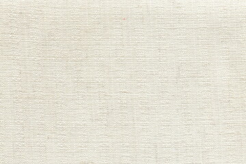 The texture of coarse linen natural fabric is white with a clear interweaving of threads. A soft napkin of a milky shade.