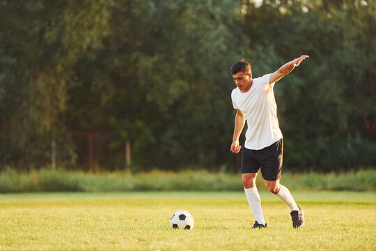 Professional practice. Young soccer player have training on the sportive field