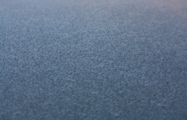 water drops on the roof of a car