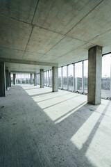 Indoors in the unfinished building. Conception of construction