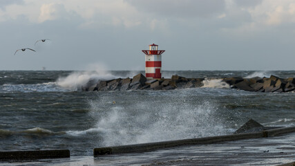 Lighthouse in the surf during storms