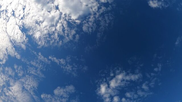 Footage time lapse white clouds were moving in the bright blue sky.