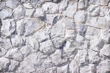 Old rock wall with seamless patterns on background and space
