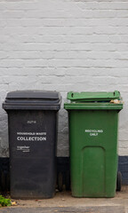 Wheelie bins in UK one black for household waste and one green for recycling