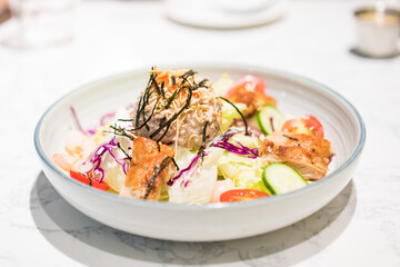 A dish of fruit and vegetable salad on the table