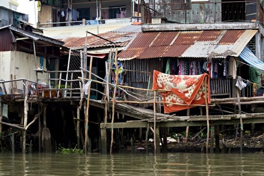 Dwellings at Vam Co Tay River. Near Tan An Town. Vietnam. Asia.