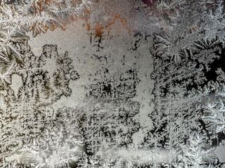 beautiful frosty patterns on the window glass