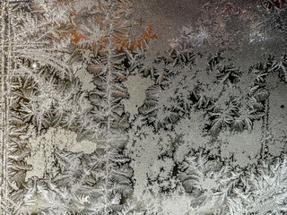 beautiful frosty patterns on the window glass