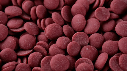 Ruby chocolate chips close up. Confectionery concept