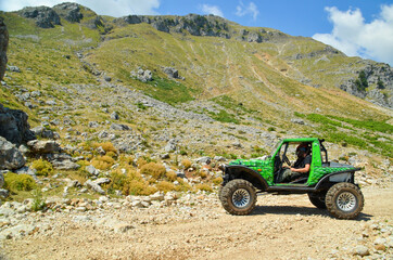 car 4x4 off road  climbing on the mountain at a car race in village theodoriana , arta perfecture , greece